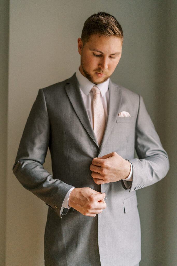 Groom with a suit from Incognito Menswear in Rochester, NY. 